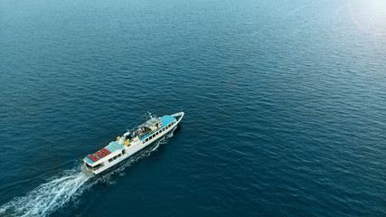 Aerial. Boat ship with tourists on a sea water.