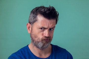 Fototapeta premium People and emotions - angry man with beard