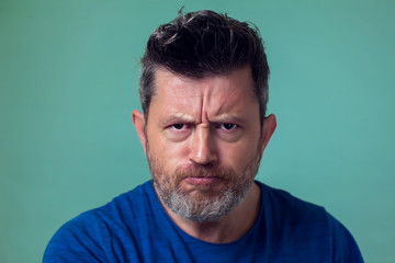 Fototapeta premium People and emotions - angry man with beard