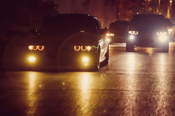 Night view of the cars. Road in the city at the night with yellow and red electrical light for cars during they are coming home. The cars compete at night. Only the lights of night carriages.