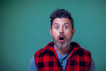 People and emotions - a portrait of man surprised about something