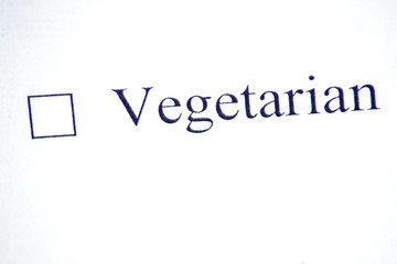 Checklist with a word Vegetarian on white paper. Checkbox and lifestyle concept.