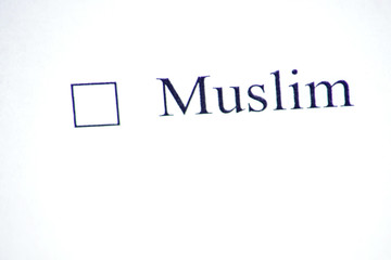 Checklist with a word Muslim on white paper. Checkbox and religion concept.