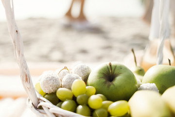 Young couple is holding hands at the beach on a sunny day.