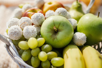 Young couple is holding hands at the beach on a sunny day.