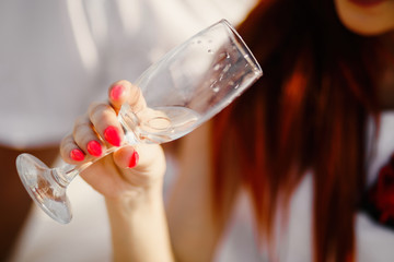 Young couple is holding hands at the beach on a sunny day.
