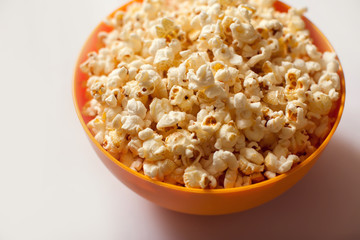 A bowl with popcorn isolated on white background. Food concept