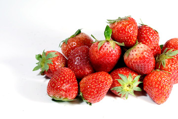 Red strawberry on white background and space for write wording, popular western fruit feed in higher part of Thailand, feel good meaningful fruit for love especially for valentines events