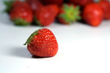 Red strawberry on white background and space for write wording, popular western fruit feed in higher part of Thailand, feel good meaningful fruit for love especially for valentines events