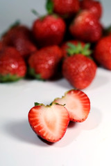 Red strawberry on white background and space for write wording, popular western fruit feed in higher part of Thailand, feel good meaningful fruit for love especially for valentines events