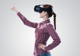 Girl in mask experiencing virtual reality as new entertainment device