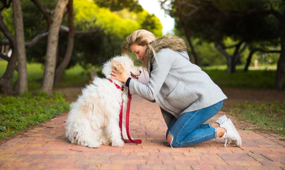 Young girl with her dog in a park