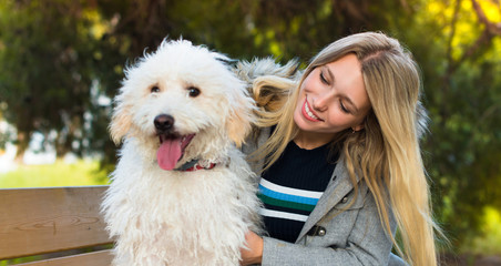 Young girl with her dog in a park