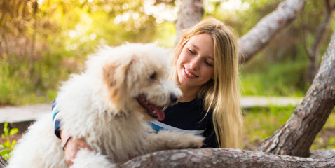 Young girl with her dog in a park