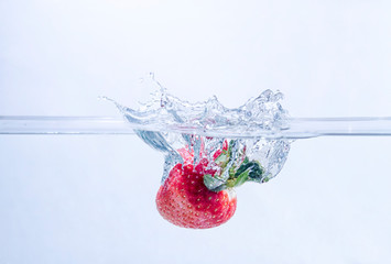 Strawberry Splashing into Water
