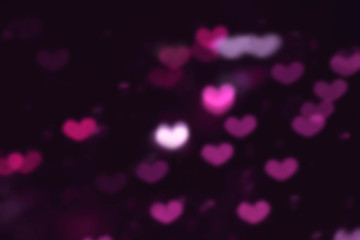 Blurred Purple Hearts background. St. Valentine's Day. Dark background. Romantic