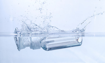 Empty Cosmetic Bottle Splashing into Water
