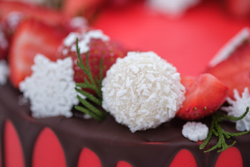 beautiful homemade red cake with fresh strawberry berries on white background