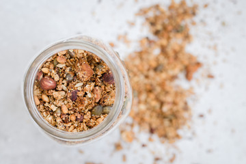 homemade roasted granola in a jar bright surface