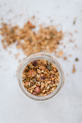homemade roasted granola in a jar bright surface