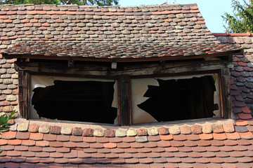 old house roof with brocken windows