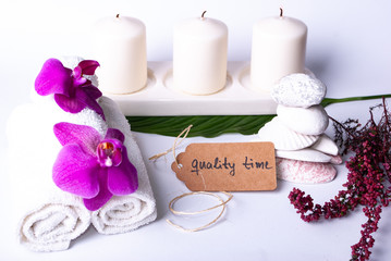A collection of wellness items and a heart built out of branches and a tag saying "quality time"