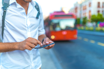 Man using navigation app on the smartphone on street