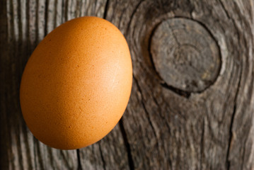 egg on weathered wooden table