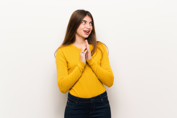 Young woman with yellow sweater scheming something