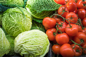 Fresh vegetables at the food market - cabbage and tomatoes