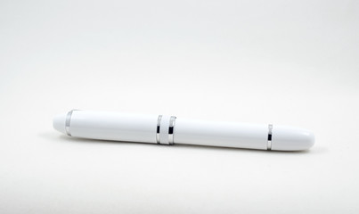 Luxury ball point pen on white background, business concept