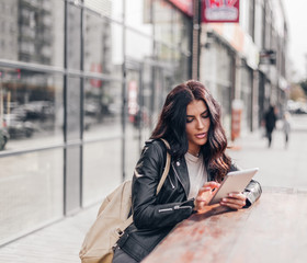 Young pretty spanish woman in cafe in city centre