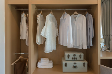 modern closet with clothes hanging