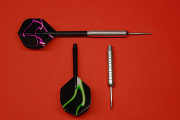 two darts for darts on a red background