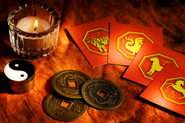Chinese coins good luck, china astrology signs and candle like Feng Shui, chinese astrology, oriental belief and I ching concept 
