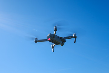 Folding drone flying in a sky