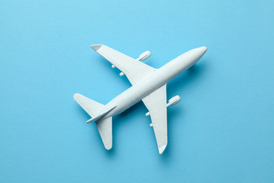 White passenger plane on blue background.