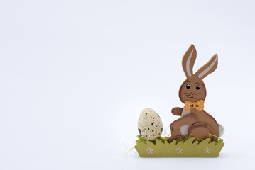 Easter background with Easter egg and bunny. Top view with copy space.