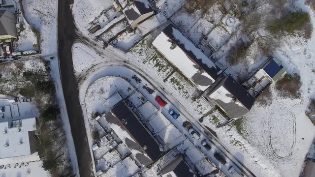 Aerial view of a small Welsh village called Nantyglo in South Wales with community and council housing  covered in snow at winter