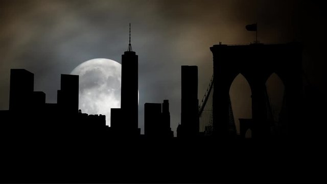 New York: Famous Skyline of Downtown from Brooklin Bridge by Night with Full Moon, Manhattan, New York City, USA
