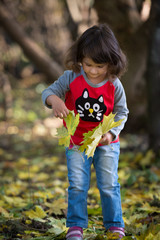 little girl in autumn park