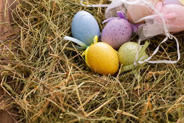 Easter eggs and decoration on wooden background