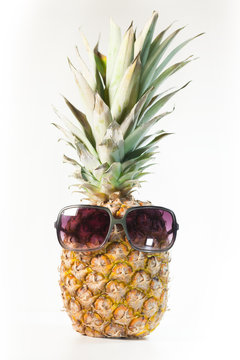 funny pineapple with sunglasses isolated on white