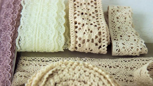 Colorful linen lace on a white textured background