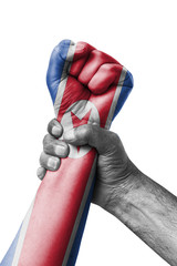Fist painted in colors of Korea north flag, fist flag, country of Korea north