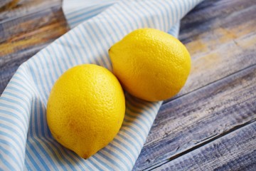 Delicious and healthy lemons.Fresh lemons on wooden background.