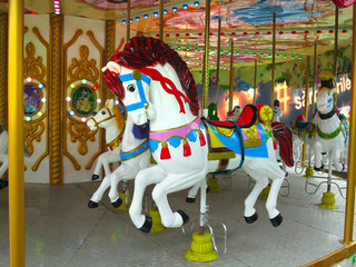 Fototapeta na wymiar 02.01.2019, Moldova, Chisinau: Traditional ‘Merry-go-round’ carousel horses