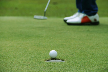 Golf ball close up on green in golf coures at Thailand