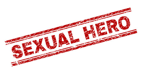 SEXUAL HERO seal print with grunge texture. Red vector rubber print of SEXUAL HERO text with unclean texture. Text tag is placed between double parallel lines.