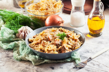 Creamy farfalle pasta with salmon, parmesan cheese and dill